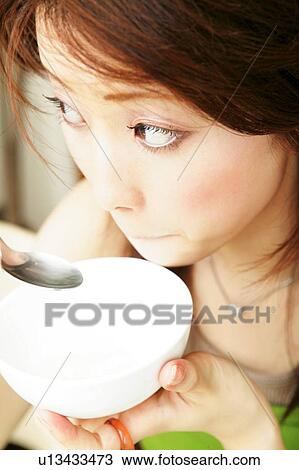 Young Adult Woman Dinking a Soup View Large Photo Image Stock Image - Young Adult Woman Dinking a Soup. Fotosearch