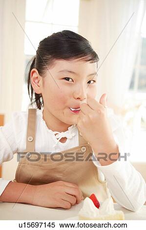 child eating a cake View Large Photo Image Stock Photography - child eating a cake. Fotosearch