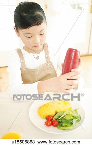 Child having a meal View Large Photo Image Stock Photo - Child having a meal. Fotosearch