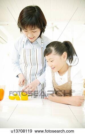 Child helping mother to cook View Large Photo Image Stock Photo - Child helping mother to cook. Fotosearch