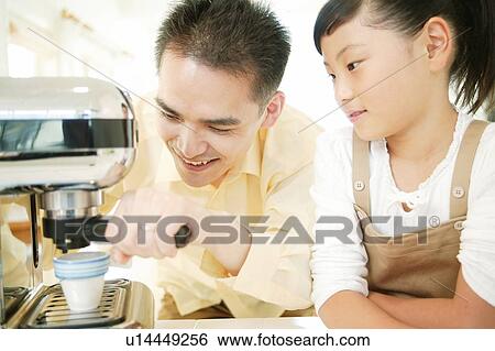 Father and child making an espresso View Large Photo Image Stock Photograph - Father and child making an espresso. Fotosearch