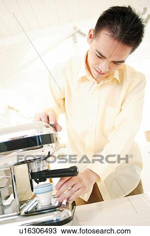 Father making an espresso View Large Photo Image Stock Image - Father making an espresso. Fotosearch