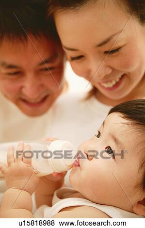 A Baby drinking a milk View Large Photo Image Stock Photo - A Baby drinking a milk. Fotosearch