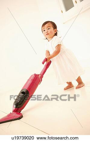 A Baby Girl Hoovering The Floor Stock Image U19739020 Fotosearch