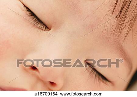 Picture - A Baby sleeping peacefully. Fotosearch