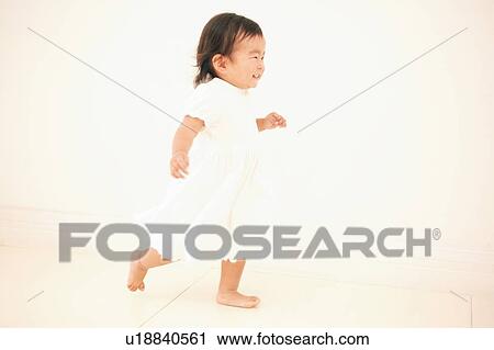 Stock Image - A toddling baby. Fotosearch