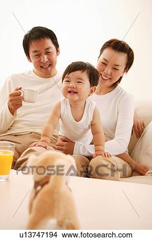Picture - Family in the living room. Fotosearch