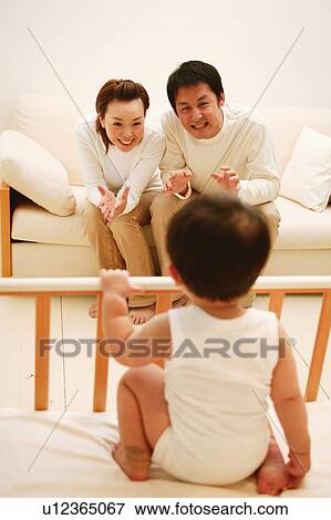 Family in the living room View Large Photo Image Stock Photo - Family in the living room. Fotosearch