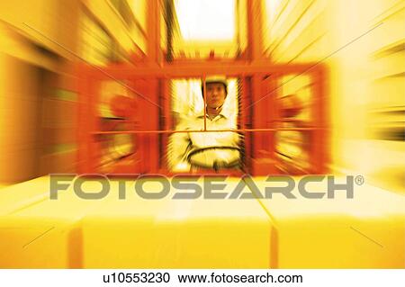 Stock Image - Construction Worker Driving. Fotosearch