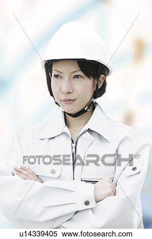 Stock Photography - Construction Worker Folding Arms. Fotosearch