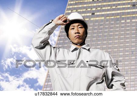 Picture - Construction Worker Putting Hand On Head. Fotosearch