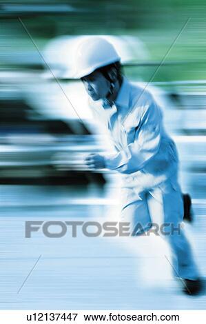 Stock Photo - Construction Worker Running. Fotosearch
