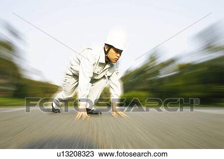 Stock Image - Construction Worker, Starting Position. Fotosearch
