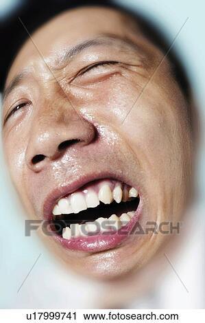 Stock Image - Delivery Man Making A Face. Fotosearch