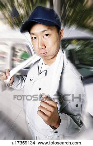 Picture - Delivery Man Posing. Fotosearch