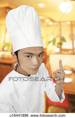 Young Chef Pointing Up View Large Photo Image Stock Photo - Young Chef Pointing Up. Fotosearch