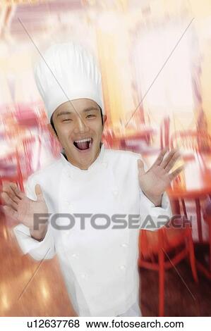 Stock Photo - Young Chef Posing. Fotosearch