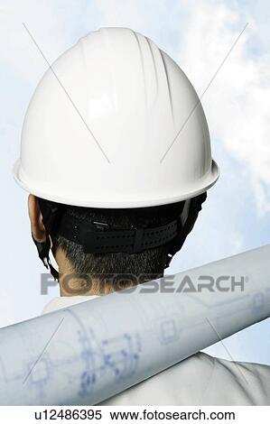Stock Photography - Young Construction Worker, Rear View. Fotosearch