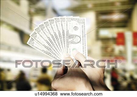 Stock Photo - Man Holding Cash. Fotosearch