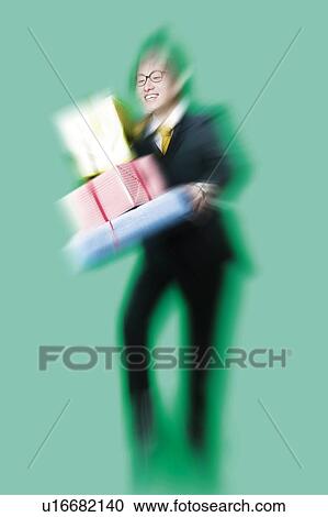 Young Man Holding Wrapped Box View Large Photo Image Stock Image - Young Man Holding Wrapped Box. Fotosearch