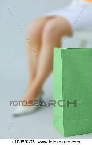 Stock Photography - Young Woman And Shopping Bag. Fotosearch
