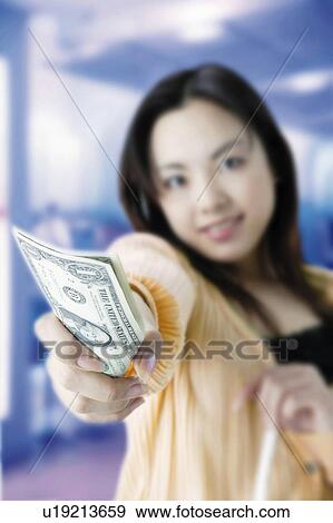 Young Woman Giving Cash View Large Photo Image Stock Photo - Young Woman Giving Cash. Fotosearch