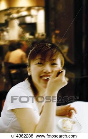 Young Woman Having Cake View Large Photo Image Stock Photo - Young Woman Having Cake. Fotosearch