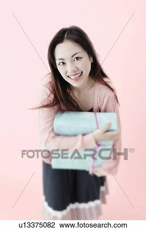 Young Woman Holding Box View Large Photo Image Stock Image - Young Woman Holding Box. Fotosearch