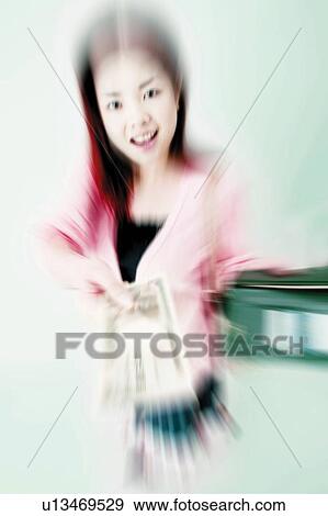 Young Woman Holding Cash View Large Photo Image Stock Photo - Young Woman Holding Cash. Fotosearch