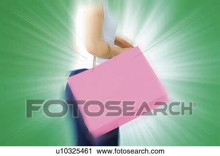 Young Woman Holding Shopping Bag View Large Photo Image Stock Image - Young Woman Holding Shopping Bag. Fotosearch