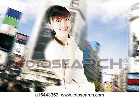 Stock Image - Young Woman Shopping. Fotosearch