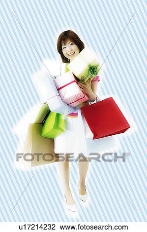 Stock Image - Young Woman Shopping. Fotosearch