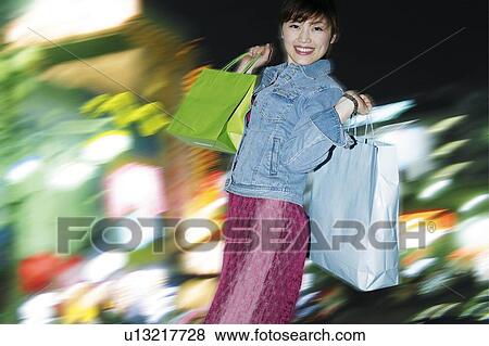 Stock Photo - Young Woman Shopping. Fotosearch