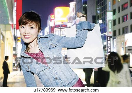 Stock Photo - Young Woman Shopping. Fotosearch