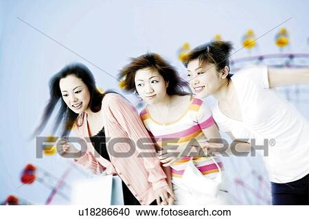 Young Women At Amusement Park View Large Photo Image Stock Image - Young Women At Amusement Park. Fotosearch