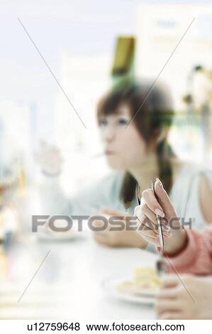 Young Women Having Cake View Large Photo Image Stock Photo - Young Women Having Cake. Fotosearch