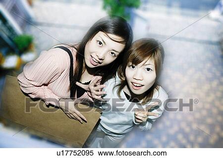 Stock Photography - Young Women Shopping. Fotosearch