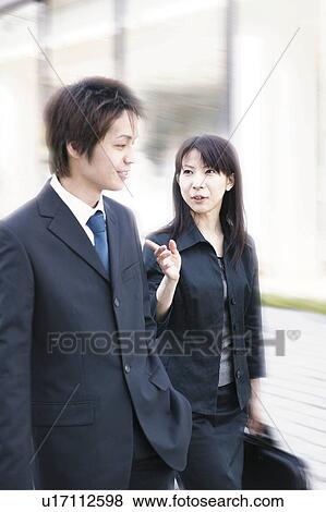 Stock Photo - A Business Man and A Business Woman. Fotosearch