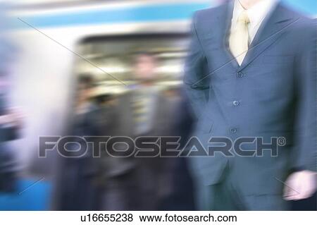 A Business Man at the station View Large Photo Image Stock Photo - A Business Man at the station. Fotosearch