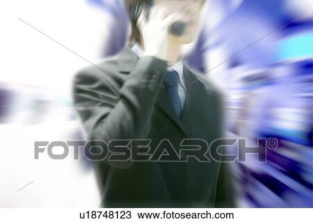 A Business Man talking on the mobile phone View Large Photo Image Stock Image - A Business Man talking on the mobile phone. Fotosearch