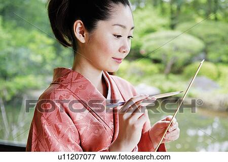Woman composing a poem, haiku, tanka View Large Photo Image Stock Photo - Woman composing a poem, haiku, tanka. Fotosearch