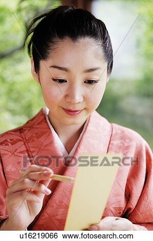 Woman composing a poem, haiku, tanka View Large Photo Image Stock Photograph - Woman composing a poem, haiku, tanka. Fotosearch