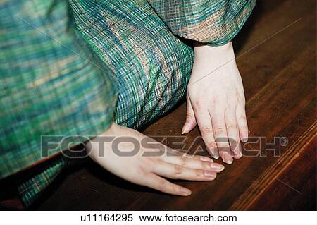 Woman making a bow, close up View Large Photo Image Stock Photography - Woman making a bow, close up. Fotosearch