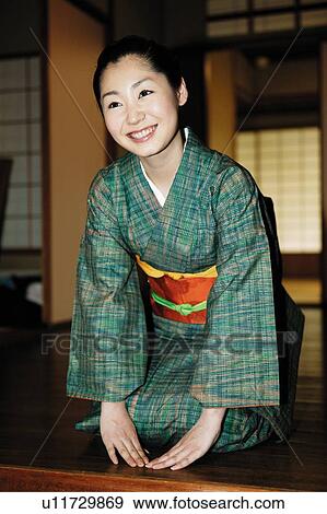 Stock Photo - Woman making a bow. Fotosearch