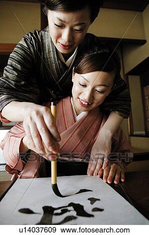 Woman teaching a shodo View Large Photo Image Stock Photo - Woman teaching a shodo . Fotosearch