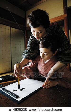 Stock Photo - Woman teaching a shodo . Fotosearch