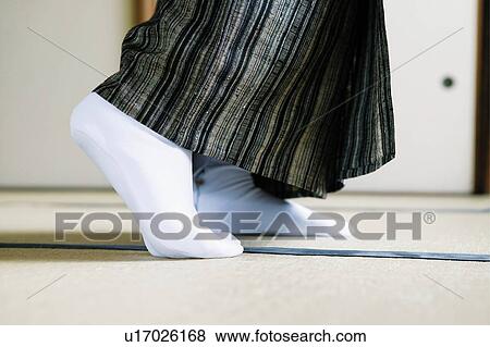 Stock Photo - Woman's feet wearing a tabi, close up. Fotosearch