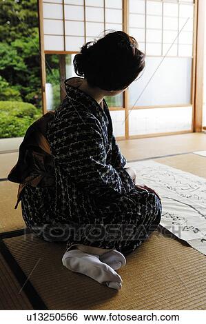 Women looking a writing View Large Photo Image Stock Photograph - Women looking a writing. Fotosearch
