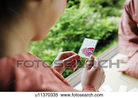 Stock Photography - Women playing a card, Karuta, Hyakunin-isshu . Fotosearch