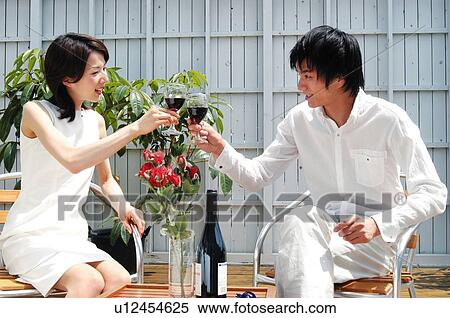 Stock Photography - Man and Woman drinking a toast. Fotosearch